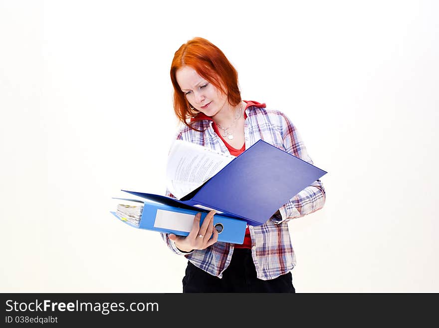 Redhead young woman with a folder in the hands