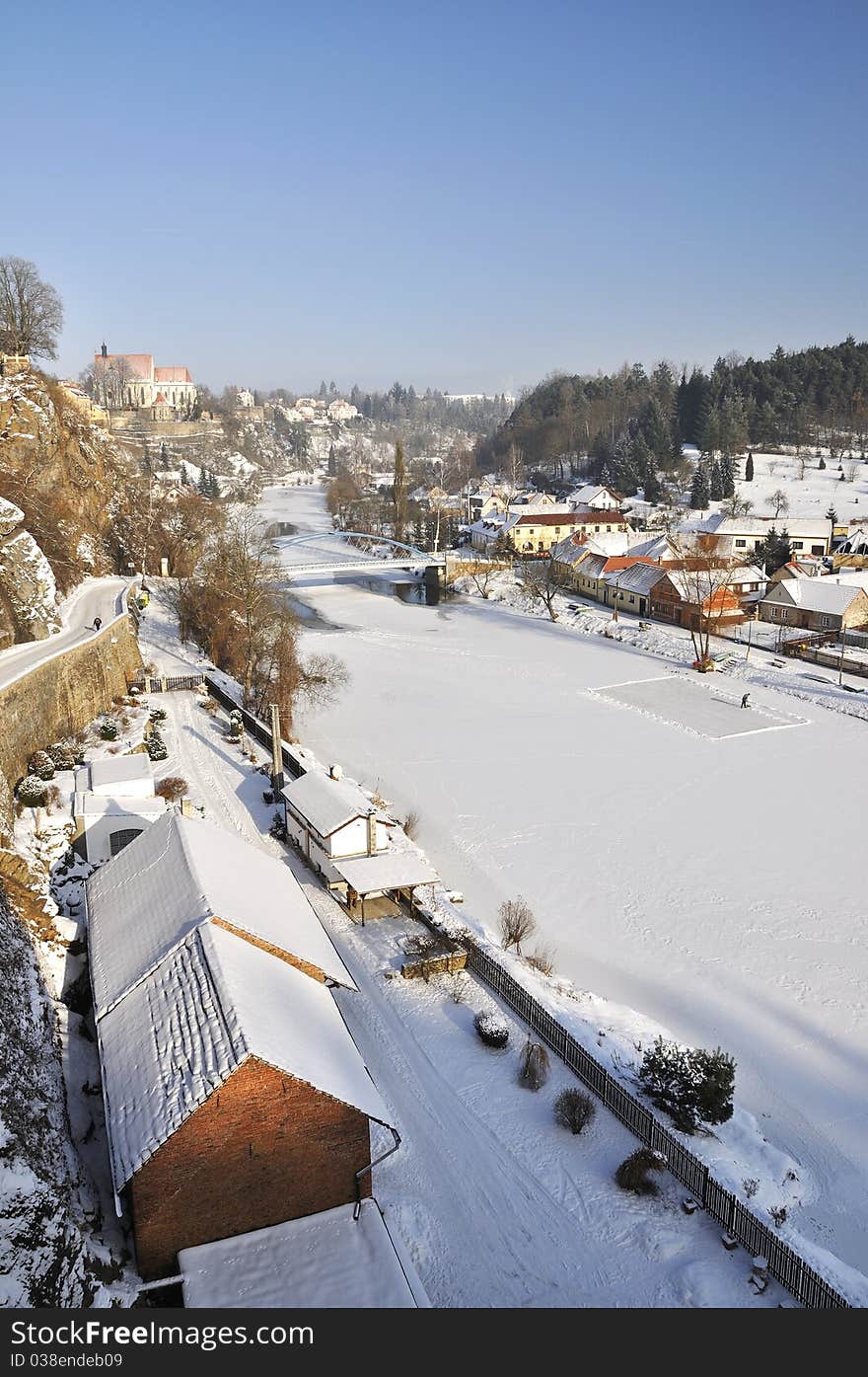 Small historical church and river Luznice in Bechyne