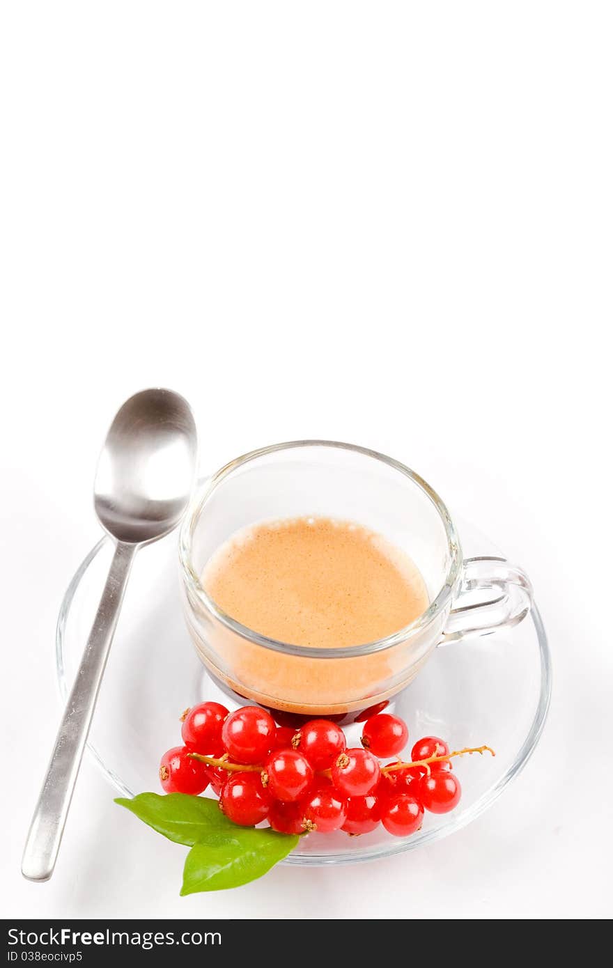 Photo of espresso with currant in glass cup on white isolated background. Photo of espresso with currant in glass cup on white isolated background