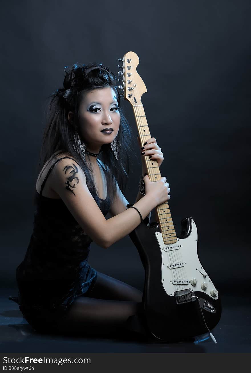 Woman rock star portrait with guitar. Woman rock star portrait with guitar