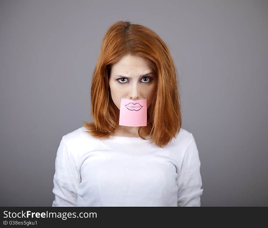 Portrait Of Red-haired Girl With Stickers On Mout