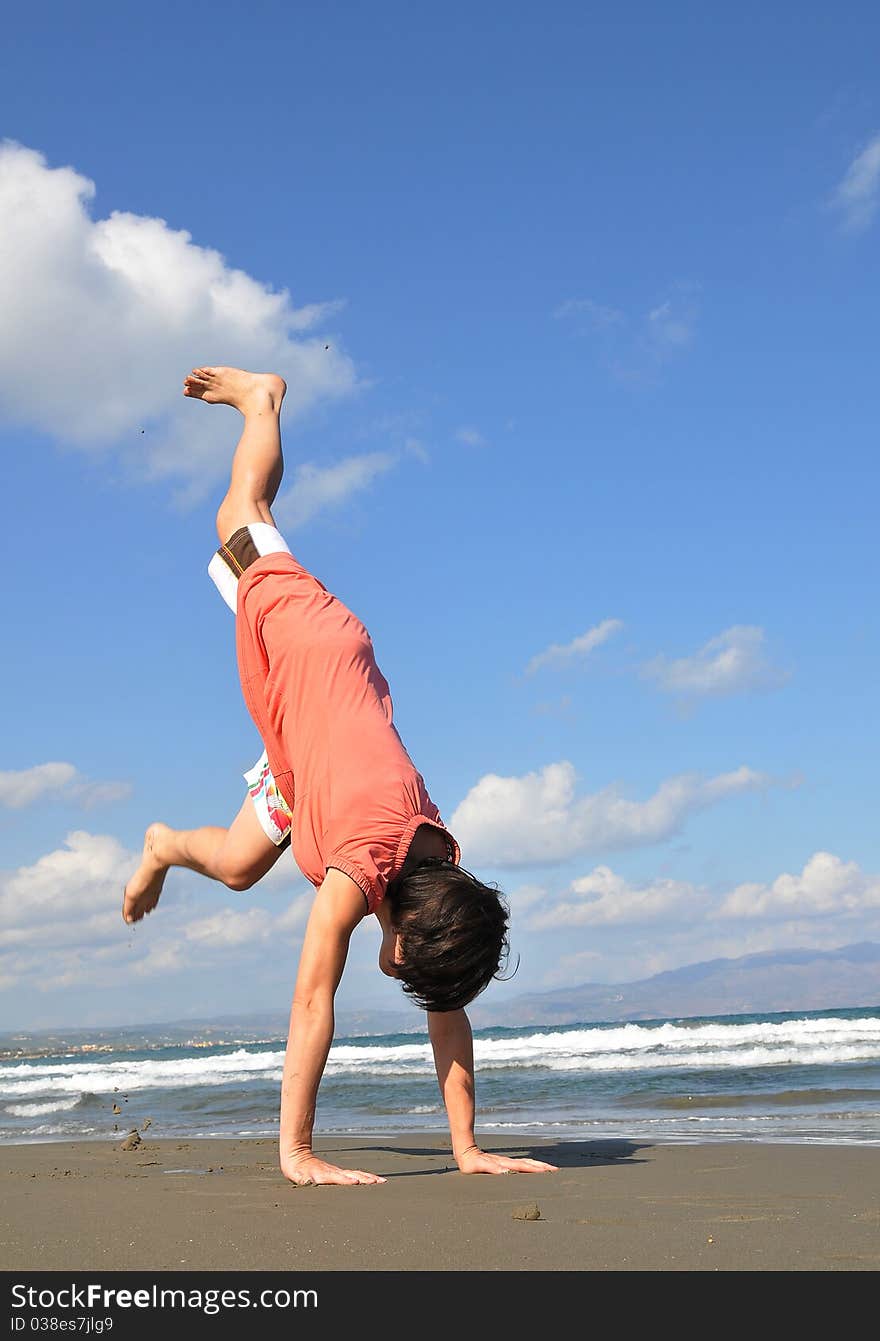 Handstand on beach