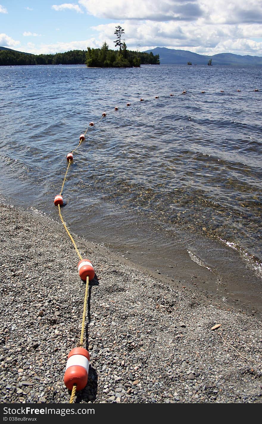 Roped buoys leading into pristine lake in Maine