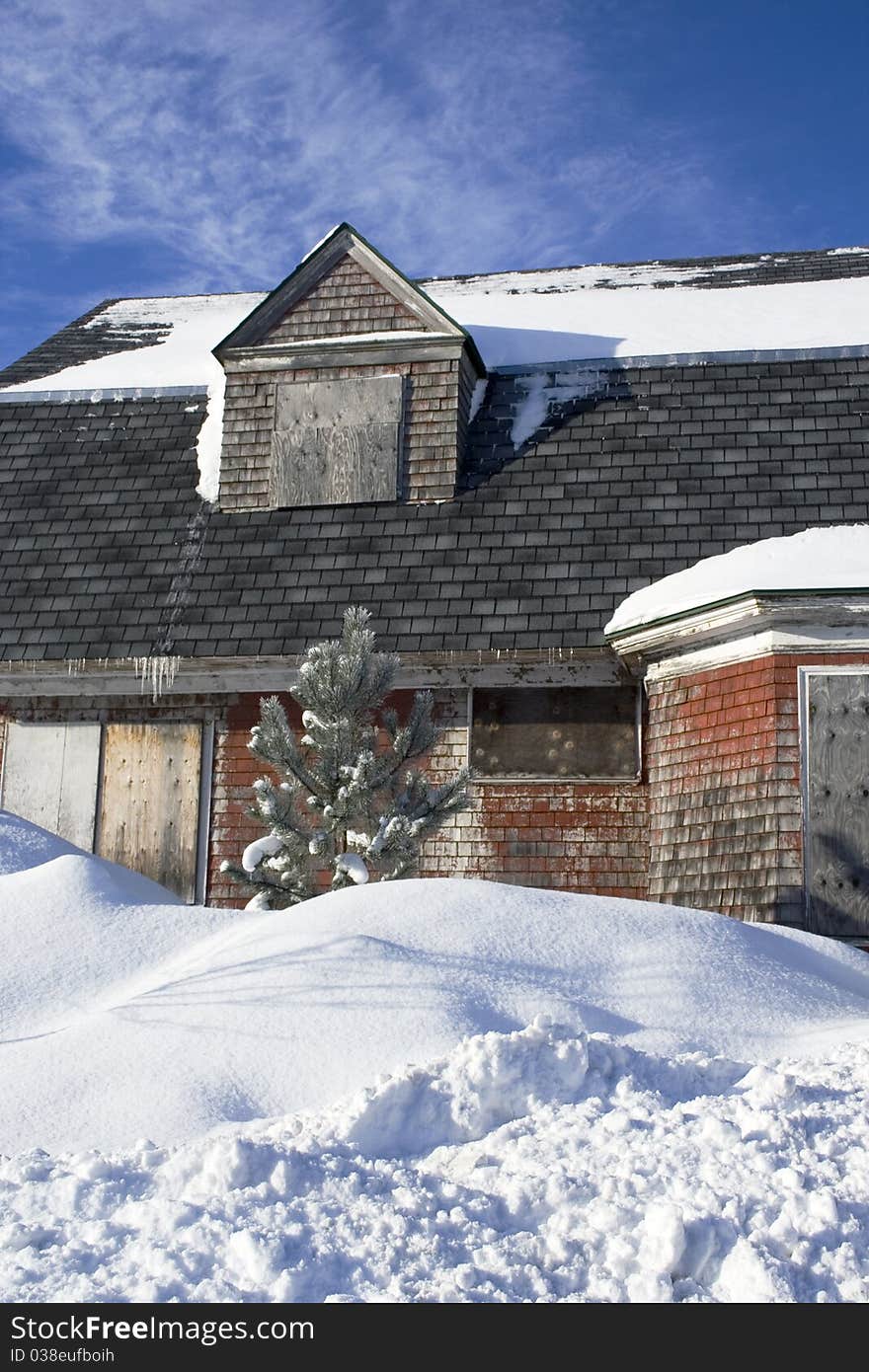 Abandoned house with snow and blue sky. Abandoned house with snow and blue sky