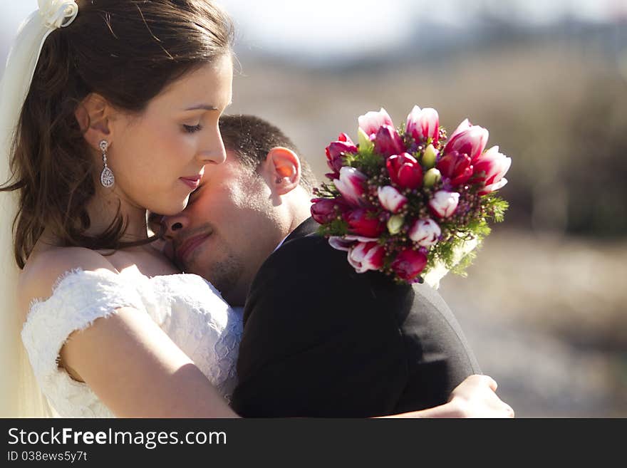 Young just married couple in romantic embrace. Young just married couple in romantic embrace.