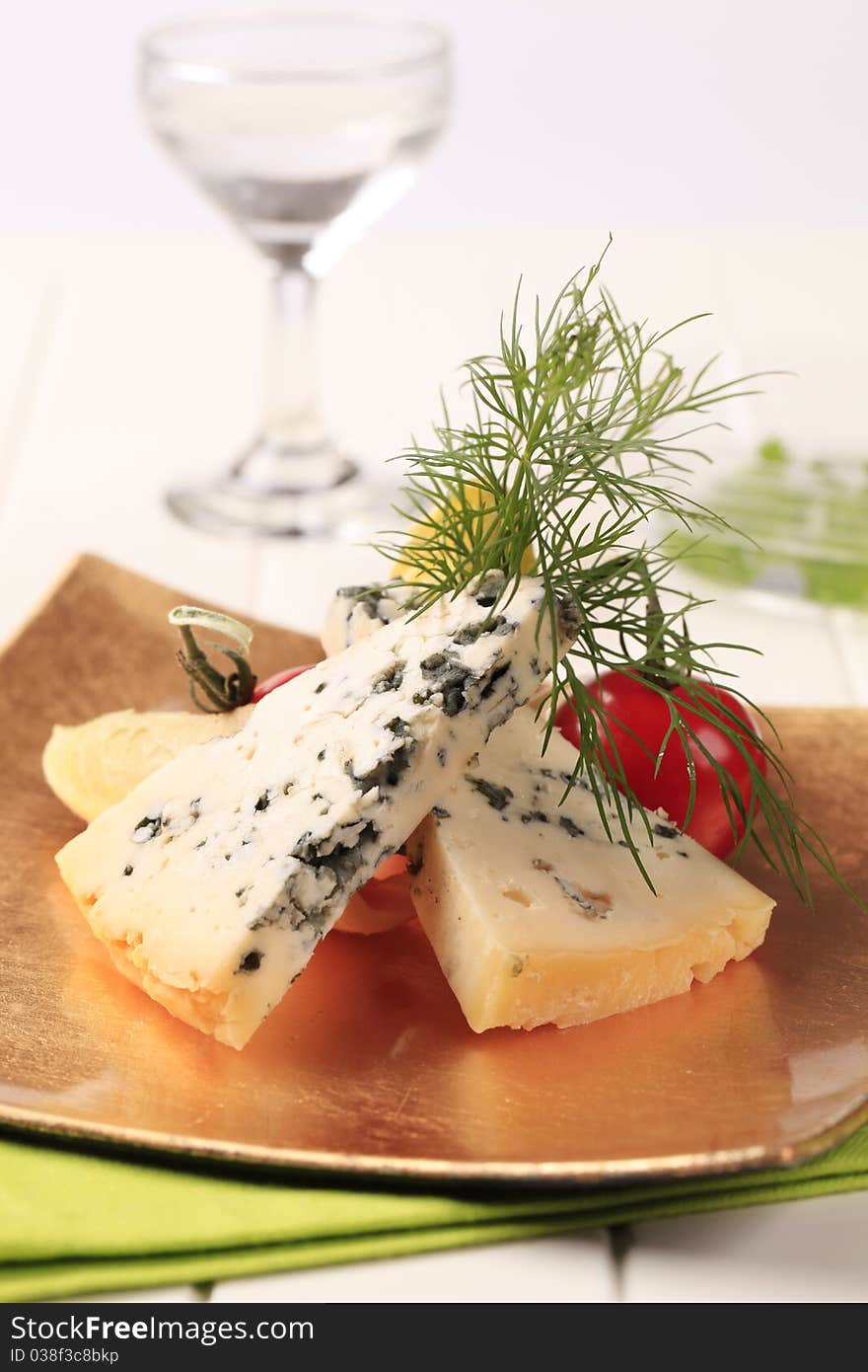 Blue cheese and fresh vegetables garnished with dill. Blue cheese and fresh vegetables garnished with dill