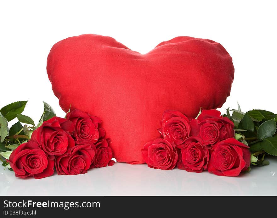 Big red heart with a bunch of a red roses isolated on white background