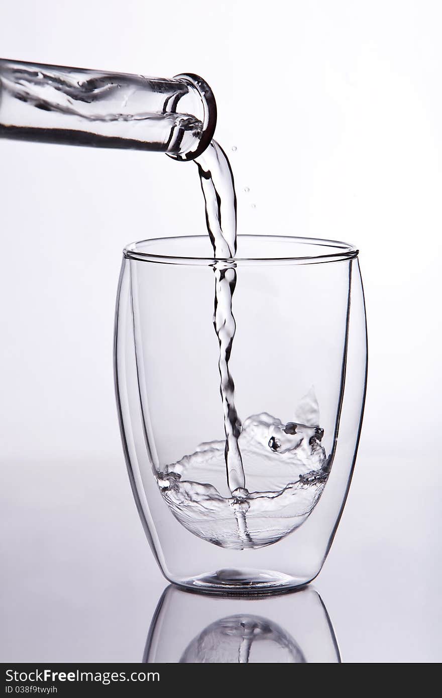 Shot of water falling into a glass. Shot of water falling into a glass.