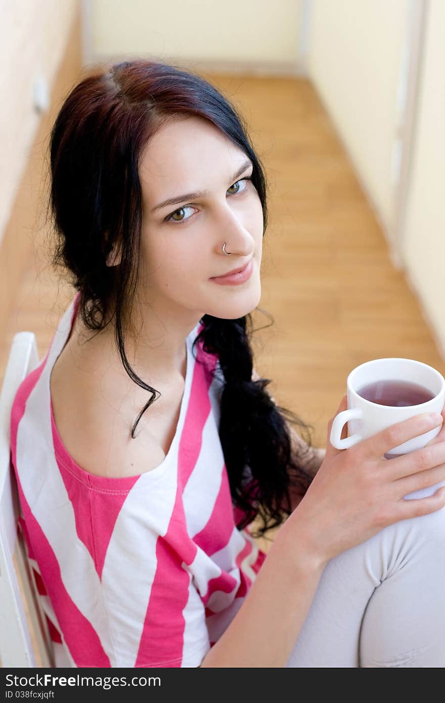 Caucasian young woman with cup of tea