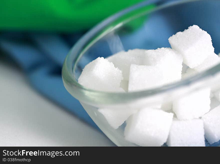 Sugar cube in clear bowl