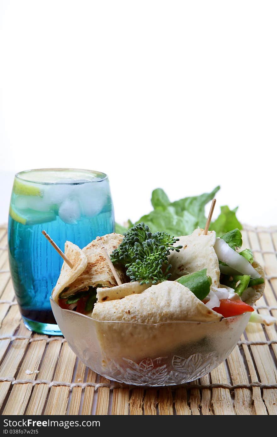 Cheese kathi rolls with blue drink over wooden background. Cheese kathi rolls with blue drink over wooden background.