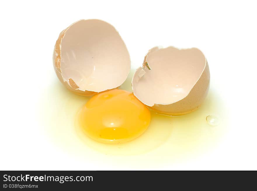 A broken egg isolated on a white background