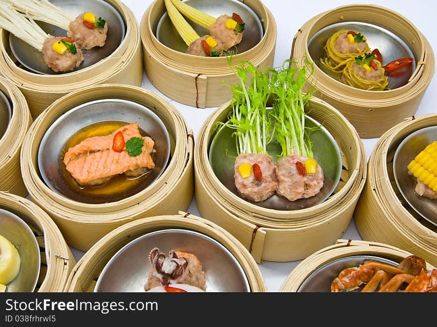 Chinese steamed dimsum in bamboo containers traditional cuisine. Chinese steamed dimsum in bamboo containers traditional cuisine