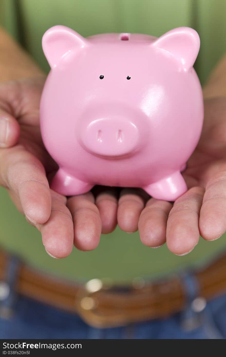 Little  pink piggy bank meaning savings.