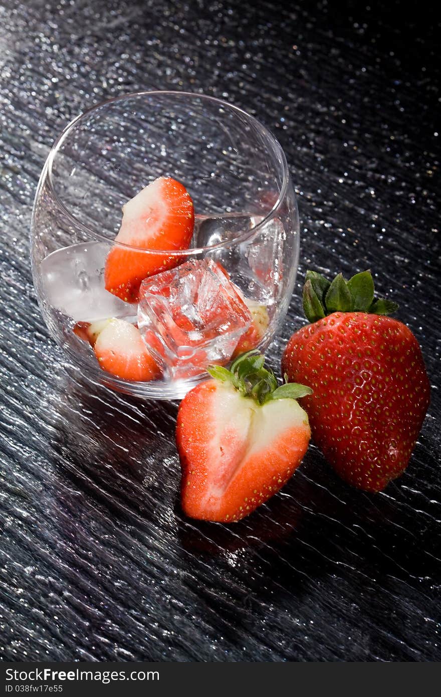 Photo of delicious red strawberries on ice cubes. Photo of delicious red strawberries on ice cubes