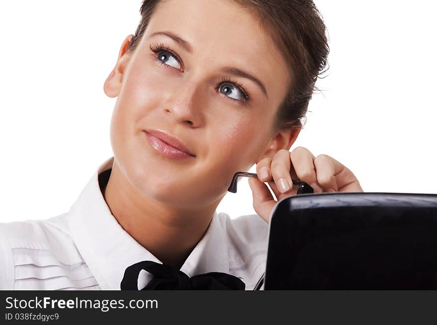 Friendly young woman at the table  with a smile