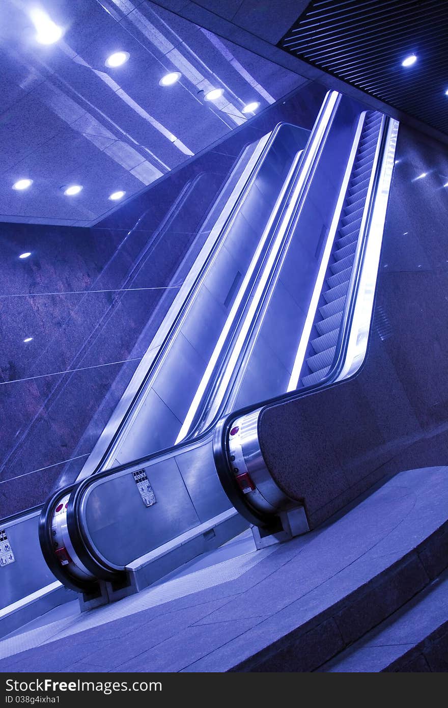 Stopped escalator in blue toning