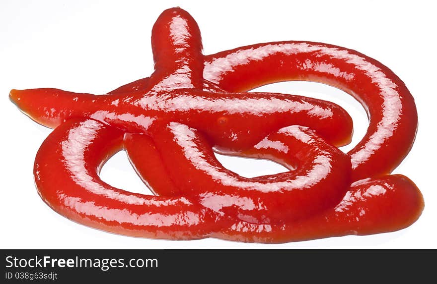 Portion of ketchup isolated on a white background. Portion of ketchup isolated on a white background.