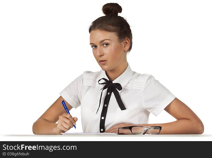 Brunette sitting at the table working with documents and thoughtful. A series of friendly office. Brunette sitting at the table working with documents and thoughtful. A series of friendly office