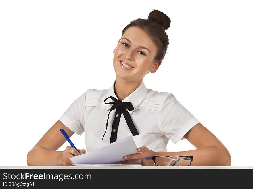 Brunette sitting at the table working with documents and thoughtful. A series of friendly office. Brunette sitting at the table working with documents and thoughtful. A series of friendly office