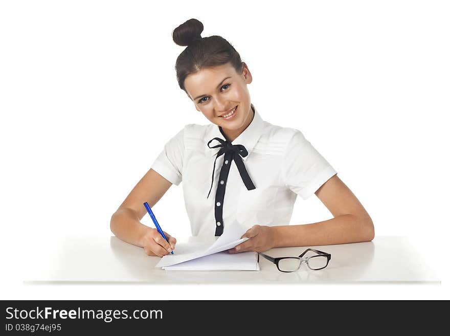 Brunette sitting at the table working with documents and thoughtful. A series of friendly office. Brunette sitting at the table working with documents and thoughtful. A series of friendly office