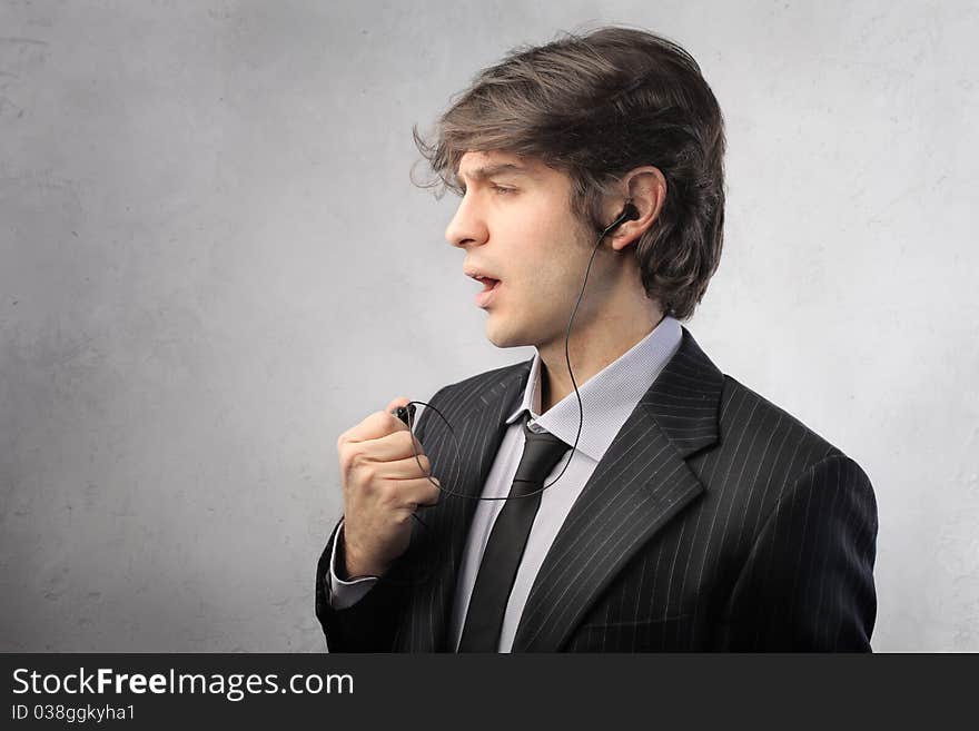 Businessman talking to telephone with a headset. Businessman talking to telephone with a headset