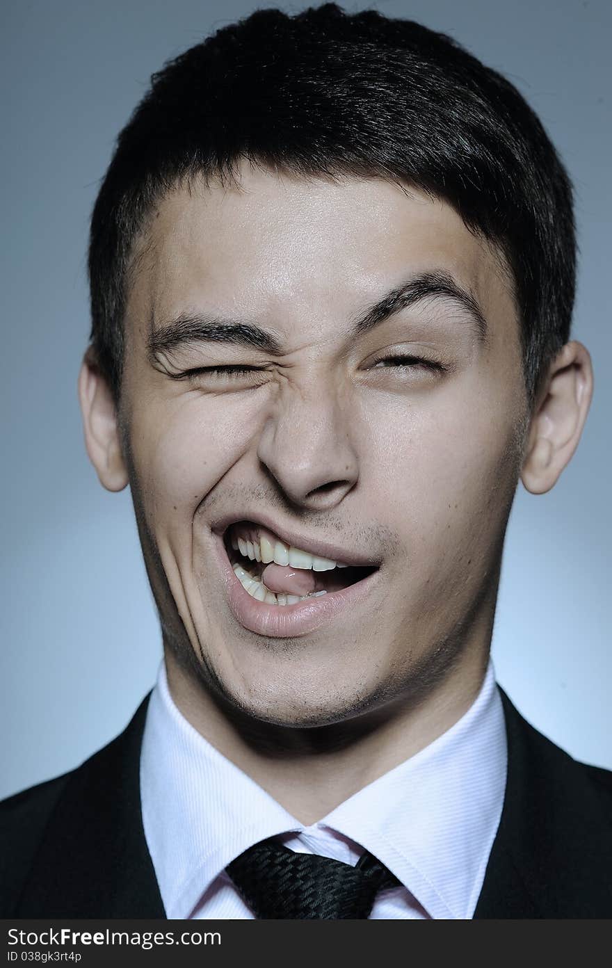 Portrait of stressed business man in formal suit and black tie screaming. gray background. Portrait of stressed business man in formal suit and black tie screaming. gray background