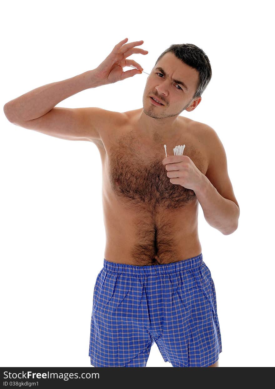 Handsome young man cleaning ears with cotton stick