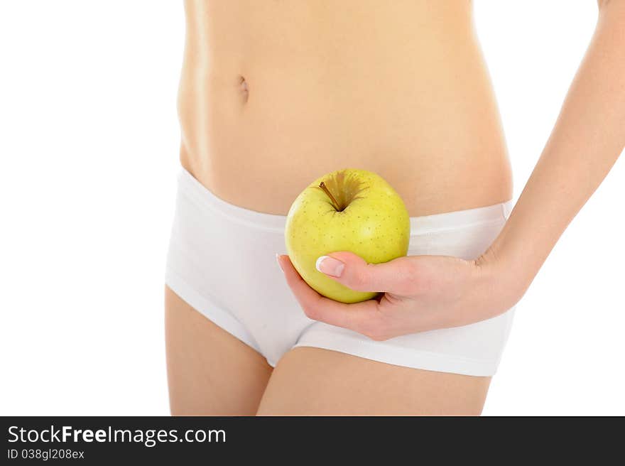 Woman with beautiful body holding an apple