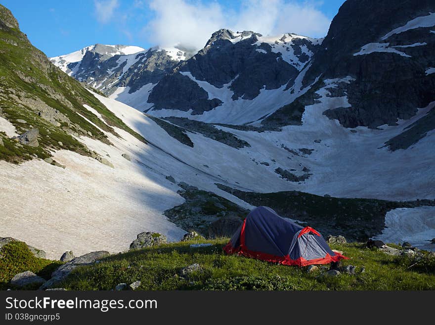 Tent on green grass in the high mountains. Tent on green grass in the high mountains