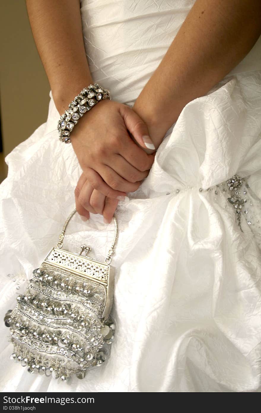 Bride holding handbag