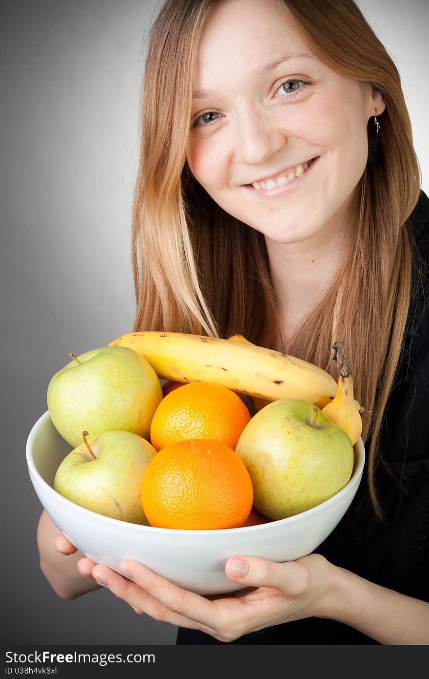 Pretty Blond Holding Healthy Fruit