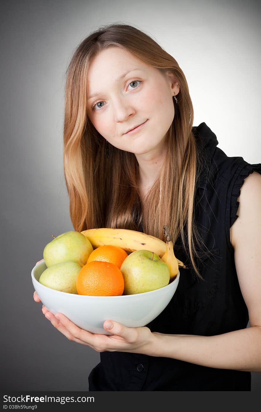 Pretty Blond Holding Healthy Fruit