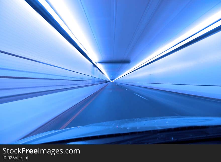 Fast drive through  a tunnel in blue color tone. Fast drive through  a tunnel in blue color tone