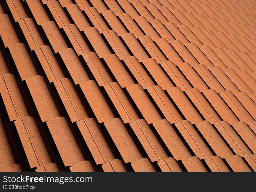 Red roof tiles pattern photo.