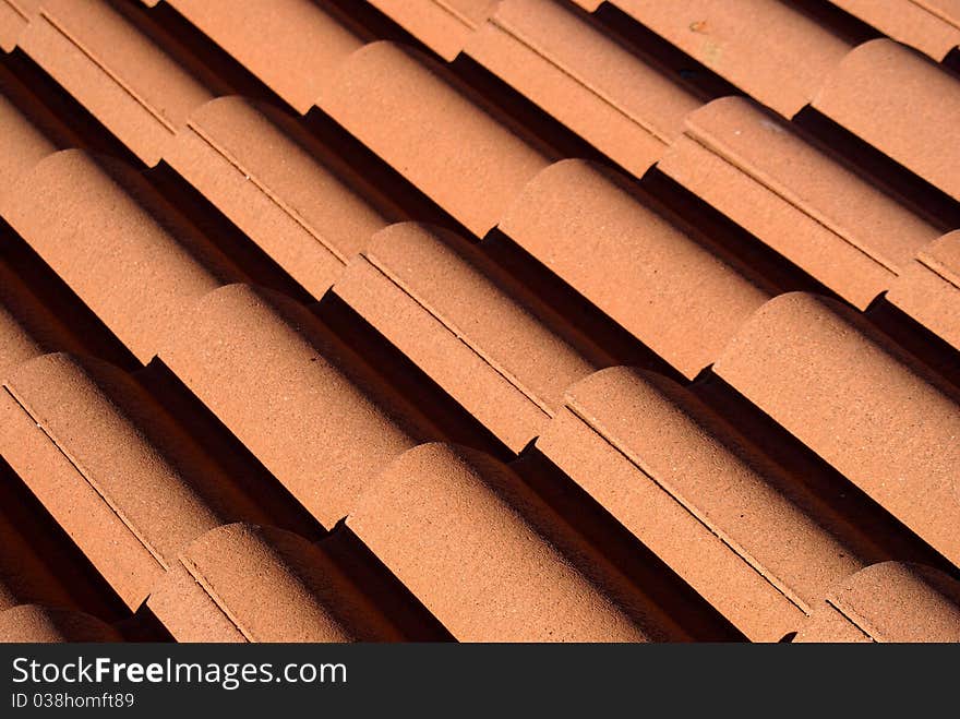 Red roof tiles pattern photo.