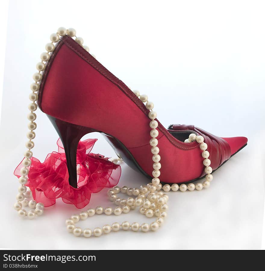 Red shoe with red garter for stocking