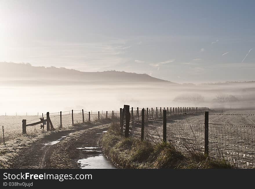 Mist over farmland on a winters morning. Mist over farmland on a winters morning