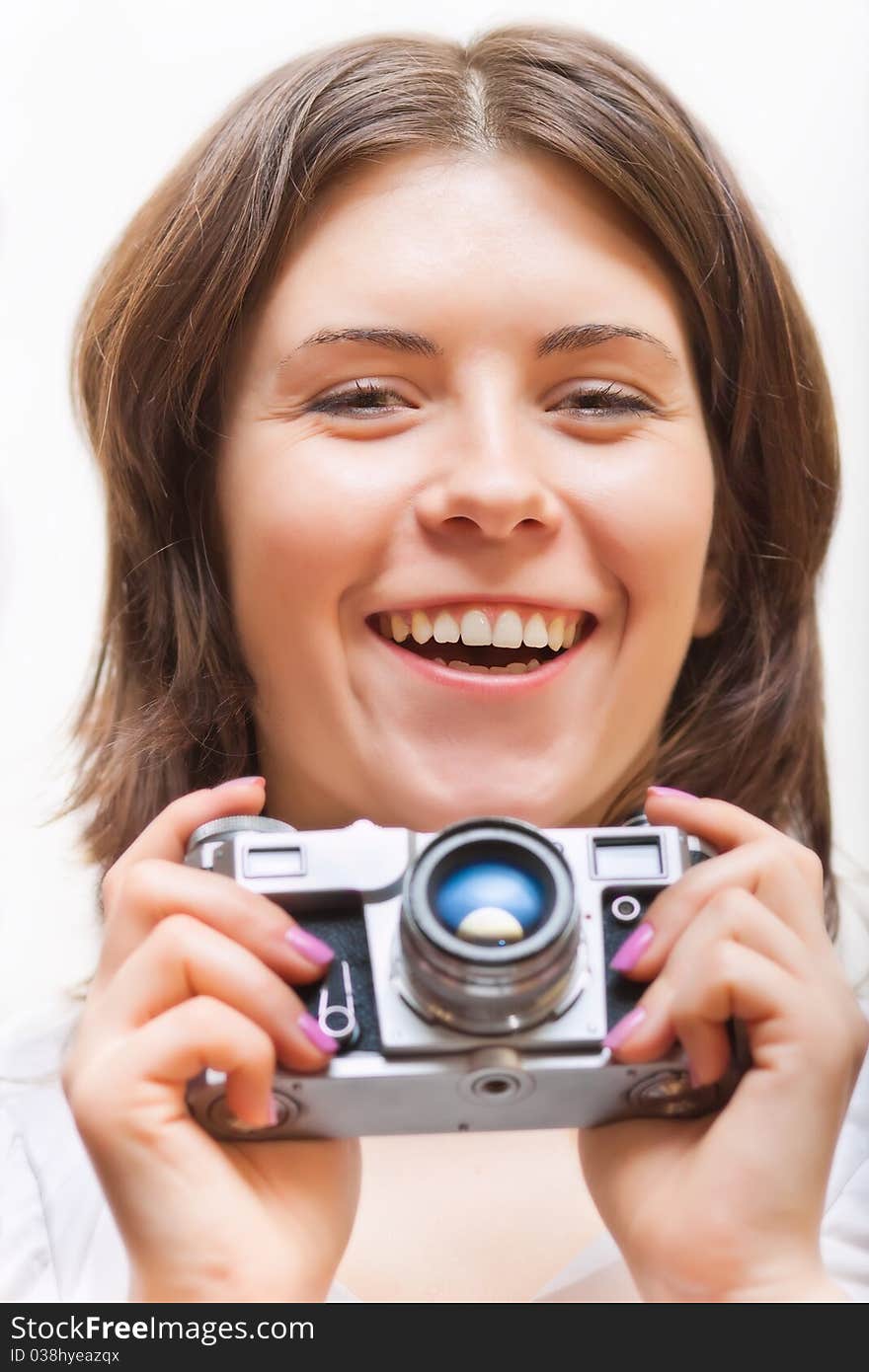 Young woman with photo camera. isolated on white. Young woman with photo camera. isolated on white