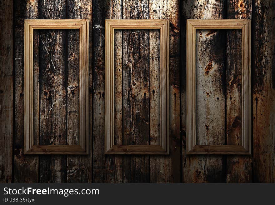 Empty frames on wooden background