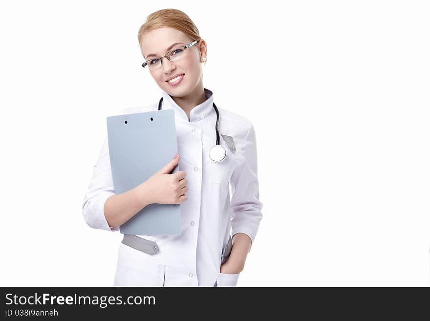 Attractive doctor with a clipboard and a stethoscope on a white background