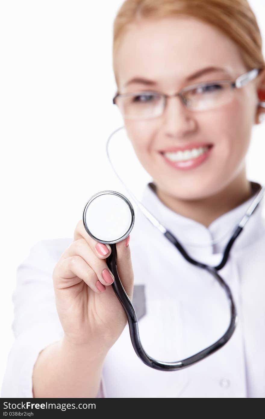 A young nurse with a stethoscope on a white background. A young nurse with a stethoscope on a white background