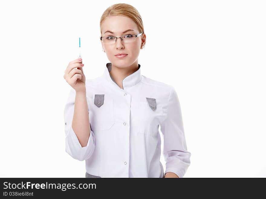 A young doctor with pregnancy tests on a white background