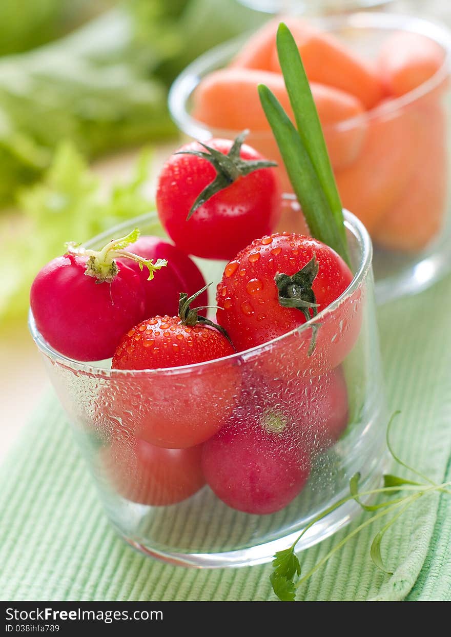 Fresh ripe vegetable in glasses on table. Fresh ripe vegetable in glasses on table