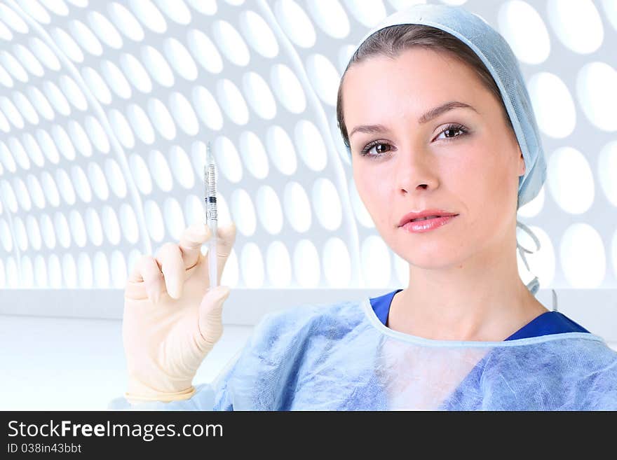 Young working beautiful woman doctor in uniform