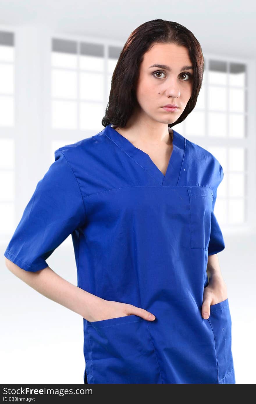 Young working beautiful woman doctor in uniform