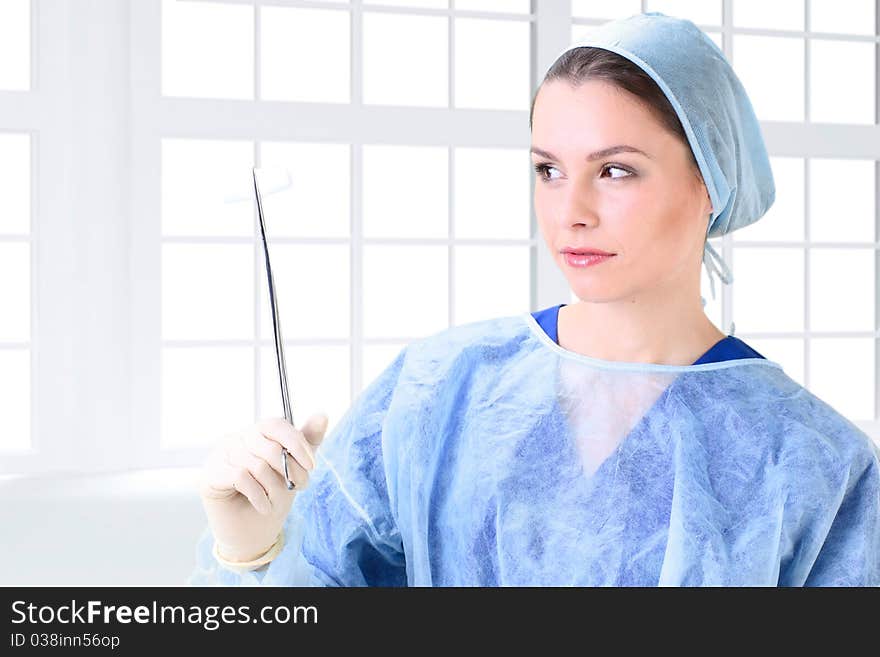 Young working beautiful woman doctor in uniform