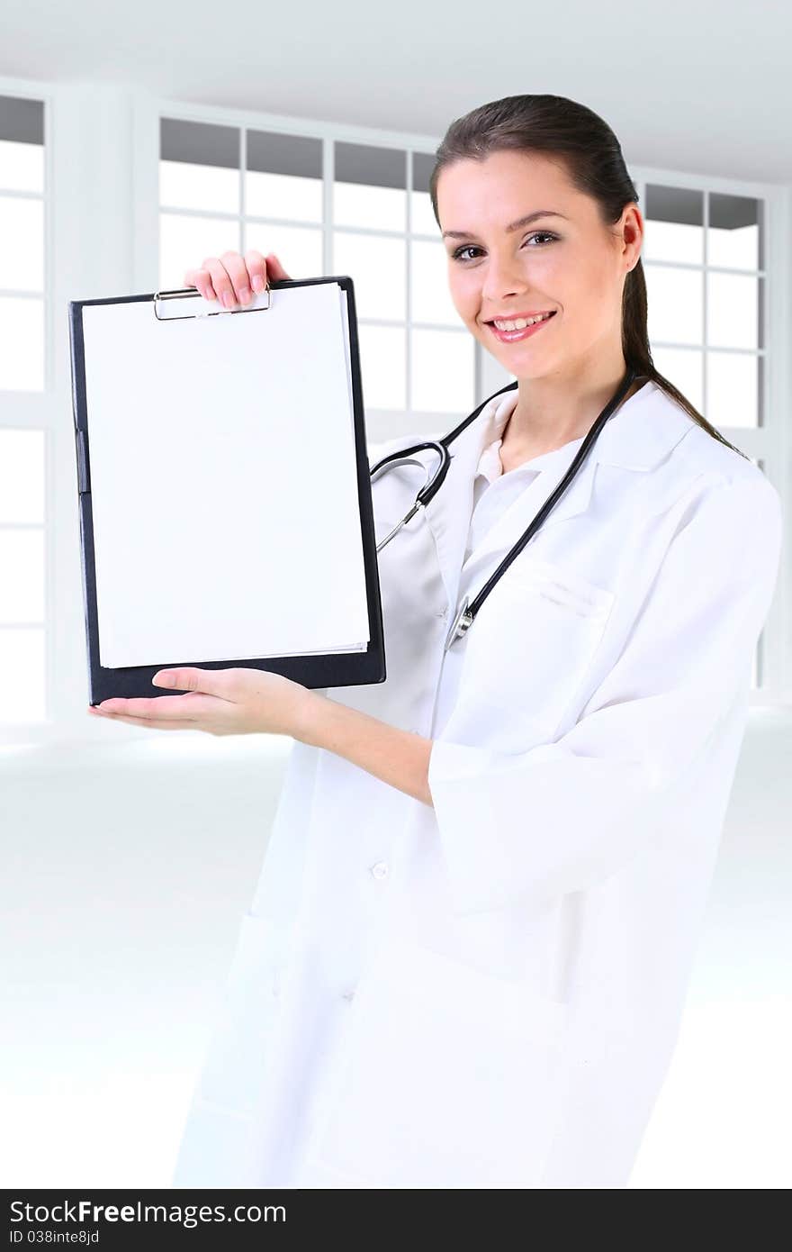 Young working beautiful woman doctor in uniform