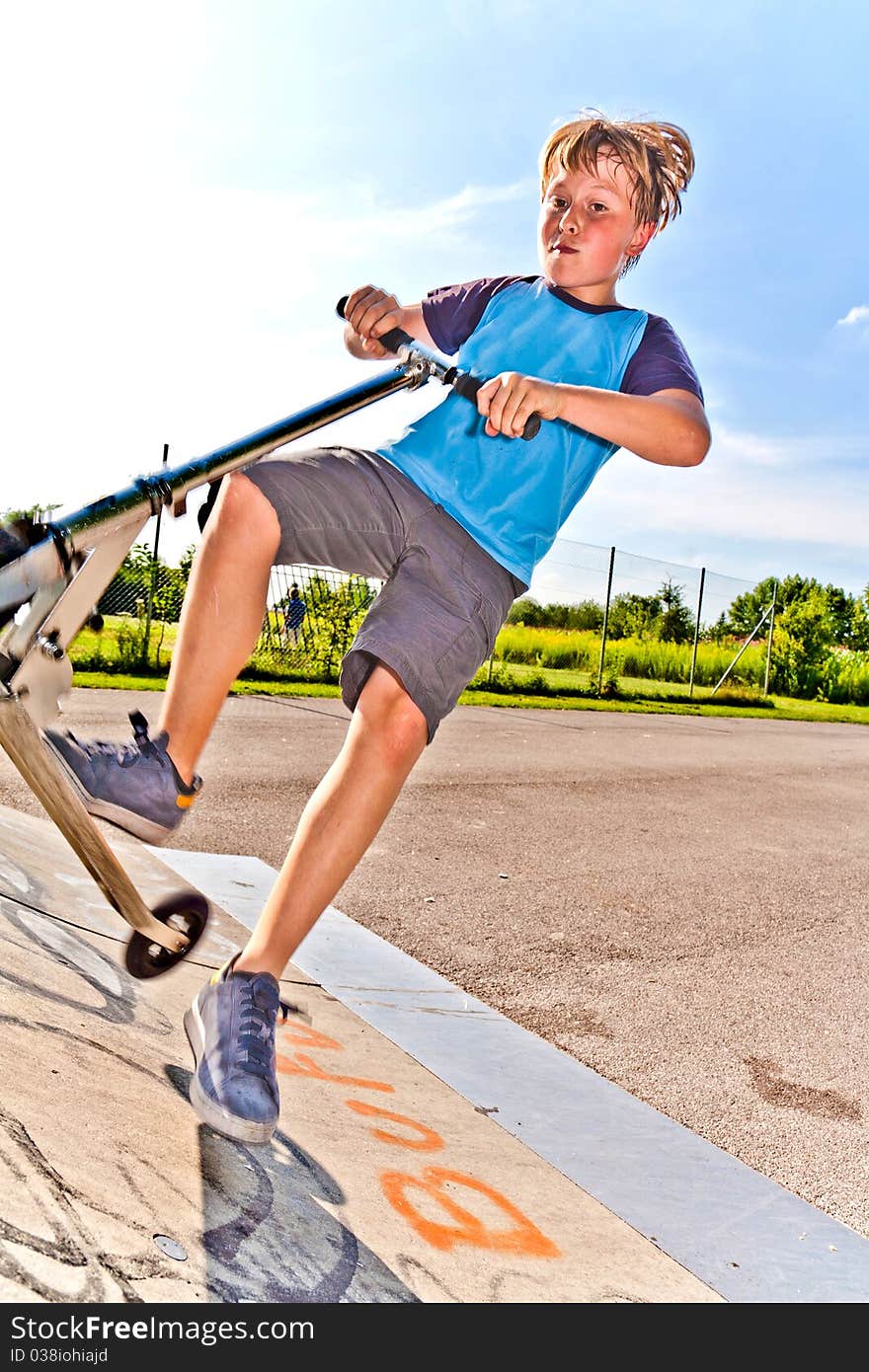 Boy is jumping with scooter in pipe. Boy is jumping with scooter in pipe