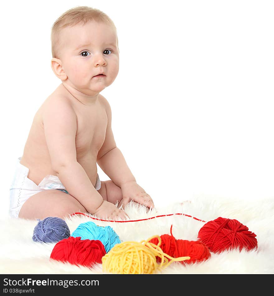 Little baby sitting on a white background